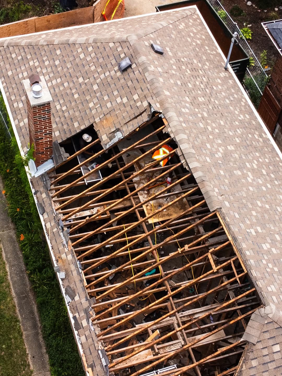 Aerial drone shot of residential roof and house demolition Toronto